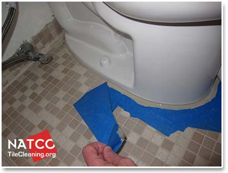 removing caulking tape from around toilet