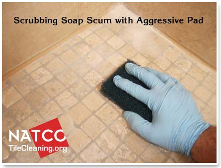 agressive scrub pad for cleaning travertine shower floor