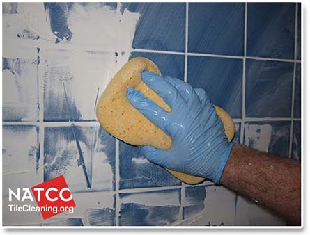cleaning excess grout with a grout sponge